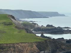 We can see the car! Hartland Quay Hotel is below the car park, and stretching into the distance, the path to Bude